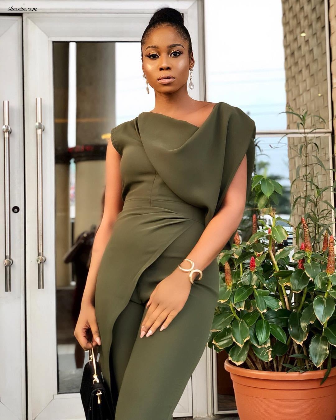 Lilian Afegbai Rocks A Ballerina Bun While Looking Impossibly Chic In Army Green